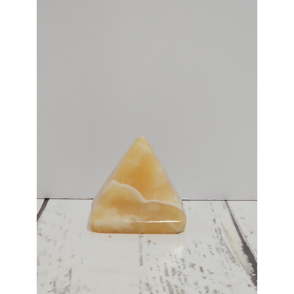 carved honey/yellow calcite pyramid
